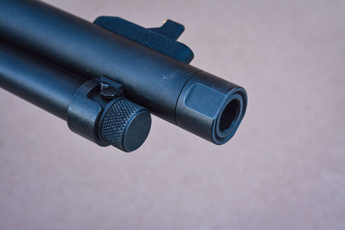 The barrel is threaded for accessories and includes a thread protector. The magazine tube is two pieces, with the inner tube being secured similar to a 22 rimfire.